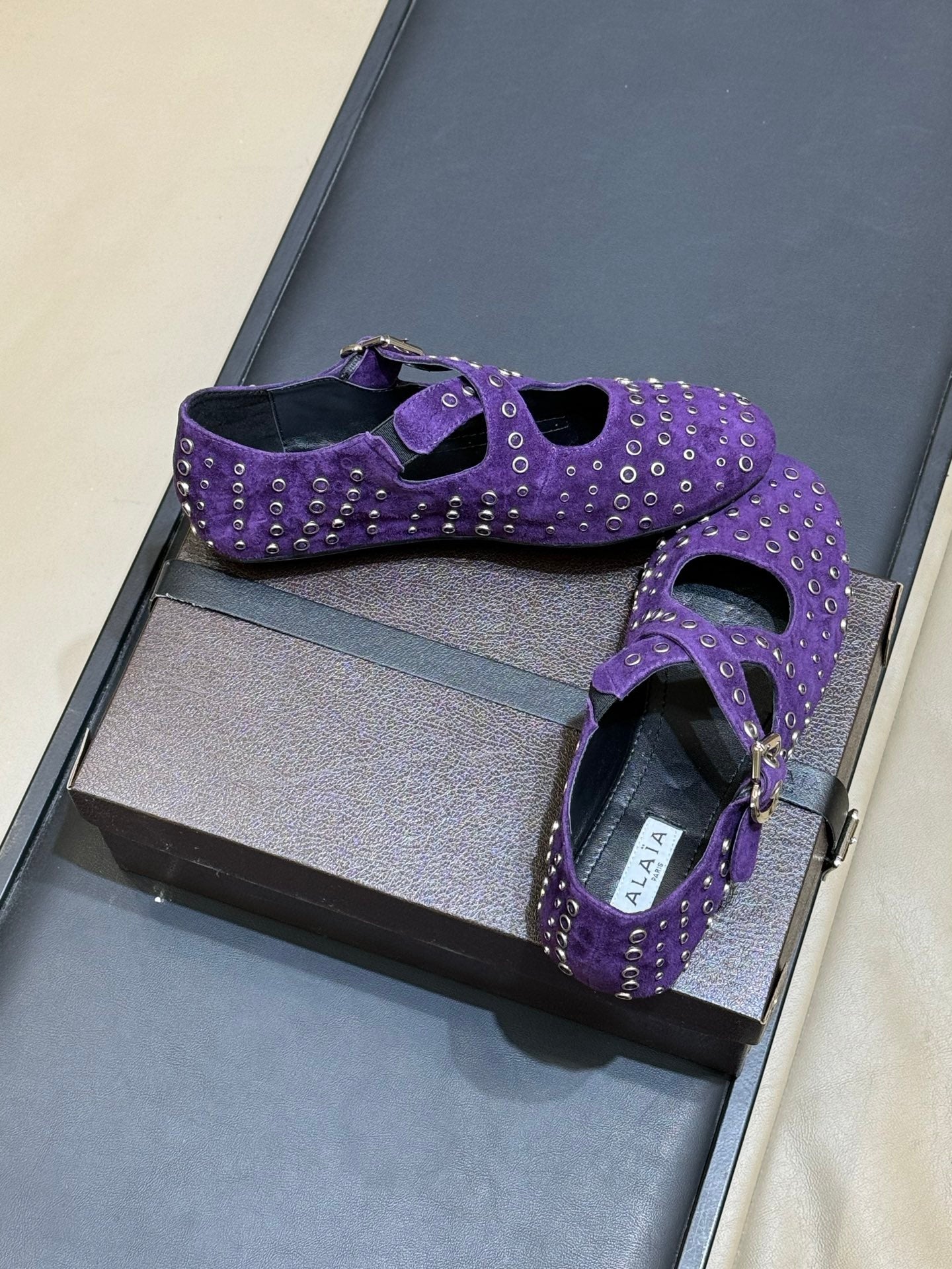 ALAIA 26S CROSS-STRAP FLATS IN PURPLE SUEDE WITH SILVER HARDWARE