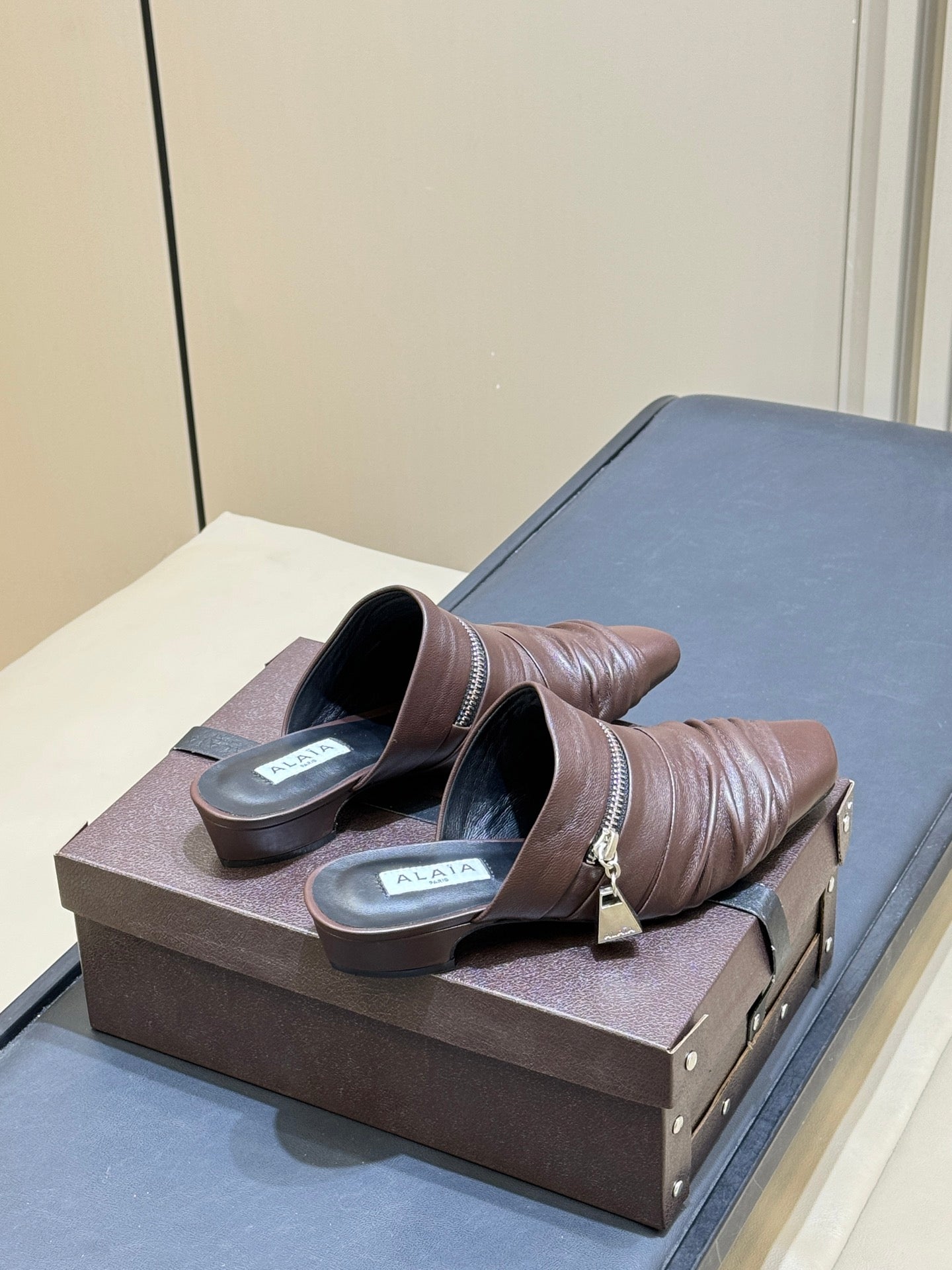 ALAIA 26S PLEATED MULES IN DARK BROWN LAMBSKIN