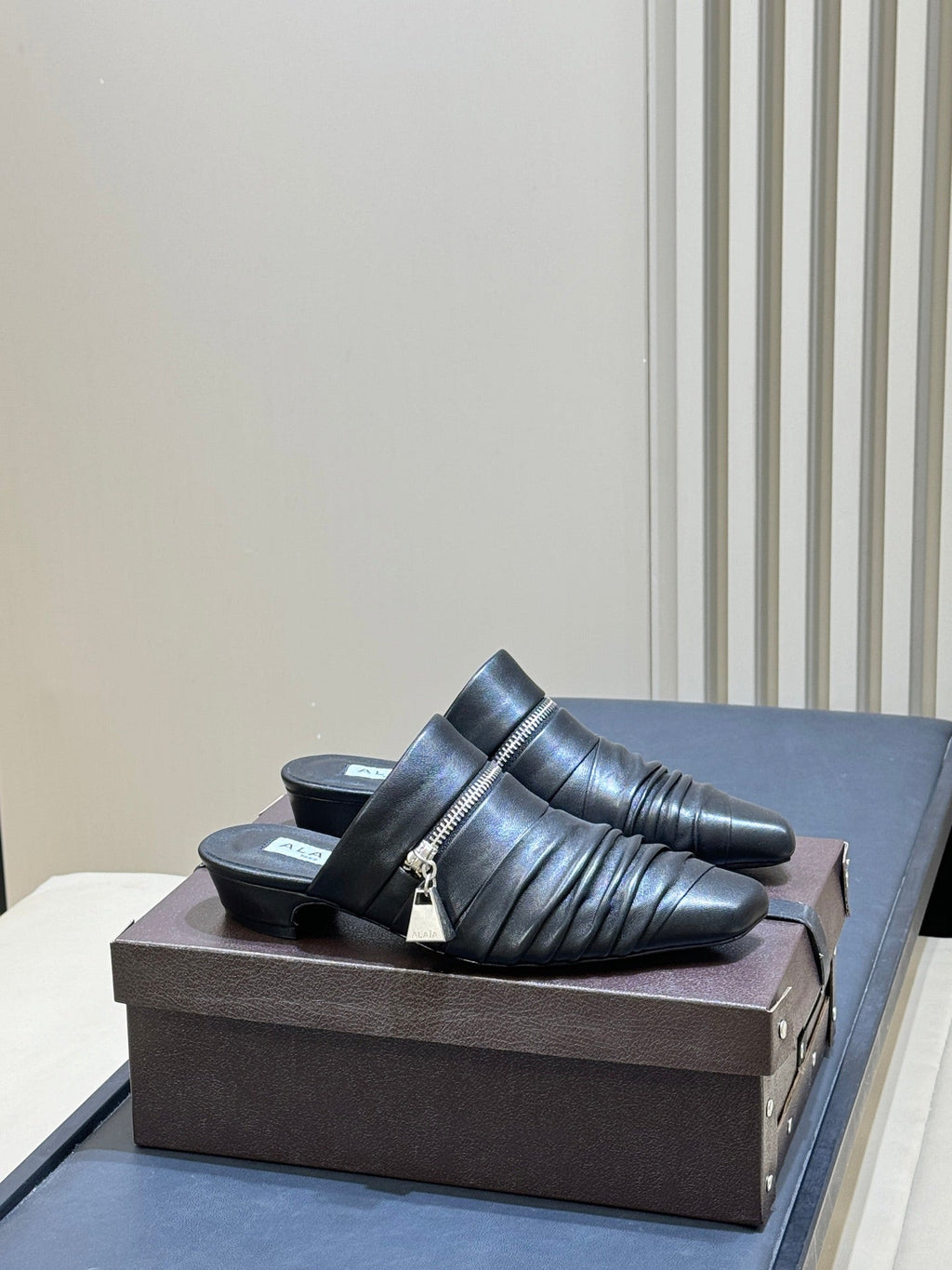 ALAIA 26S PLEATED MULES IN BLACK LAMBSKIN