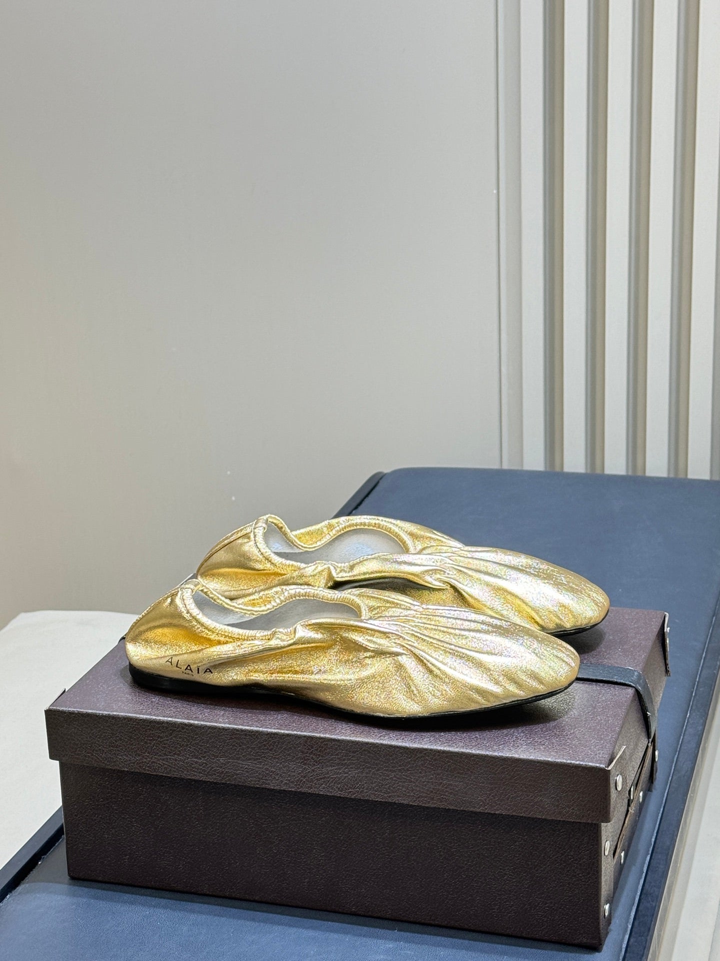 ALAIA 26S BALLET FLATS IN GOLD LAMBSKIN