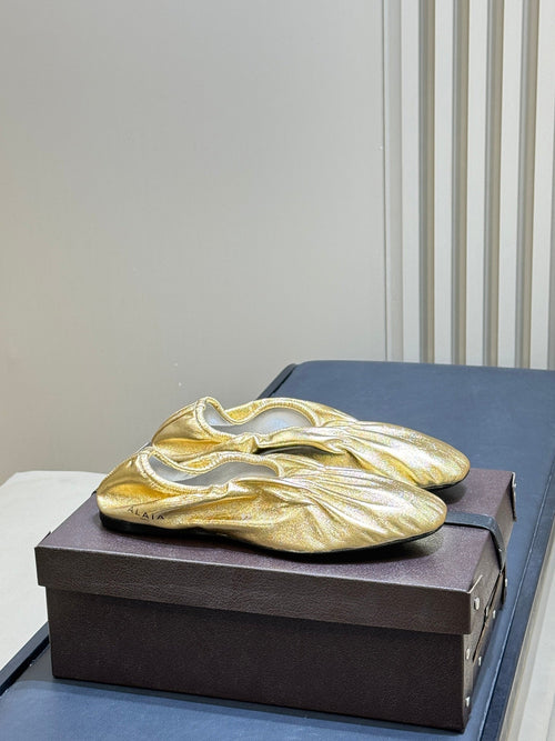 ALAIA 26S BALLET FLATS IN GOLD LAMBSKIN