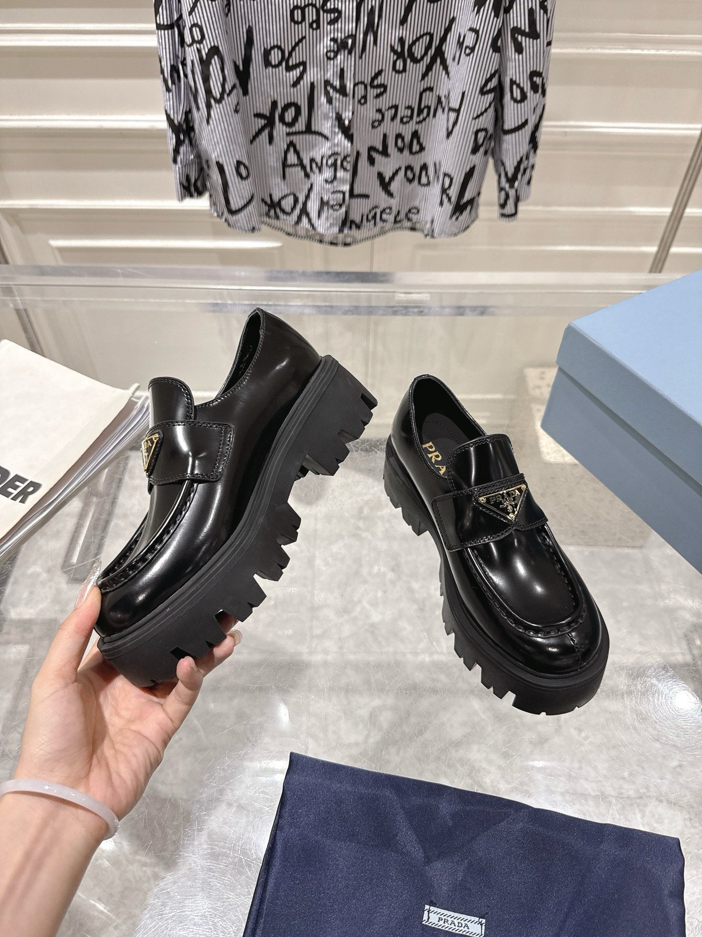 PRADA 26S PLATFORM LOAFERS 45MM IN BLACK SHINE CALFSKIN