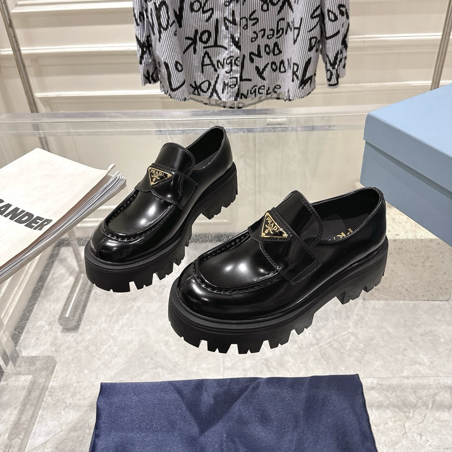 PRADA 26S PLATFORM LOAFERS 45MM IN BLACK SHINE CALFSKIN