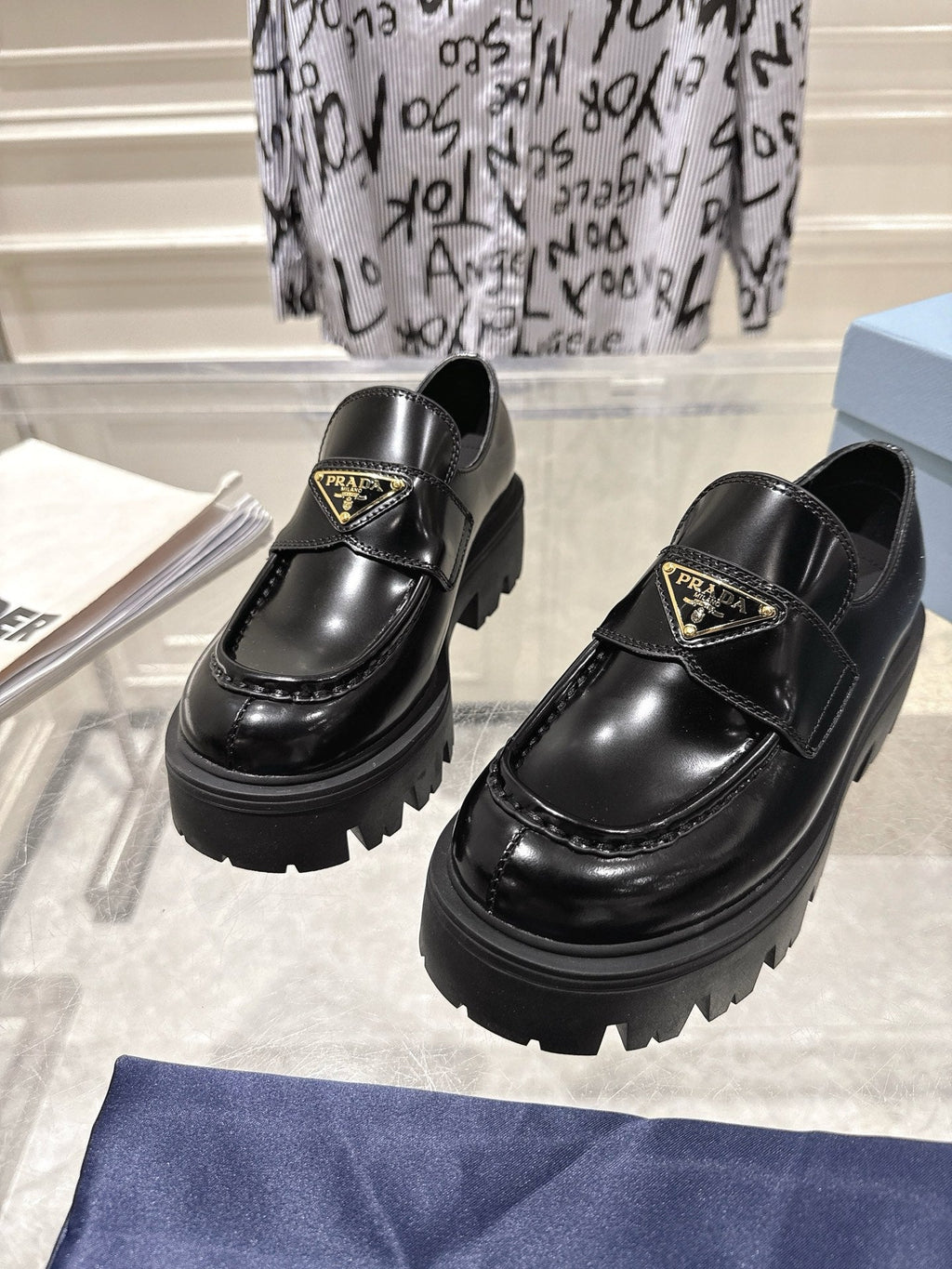 PRADA 26S PLATFORM LOAFERS 45MM IN BLACK SHINE CALFSKIN