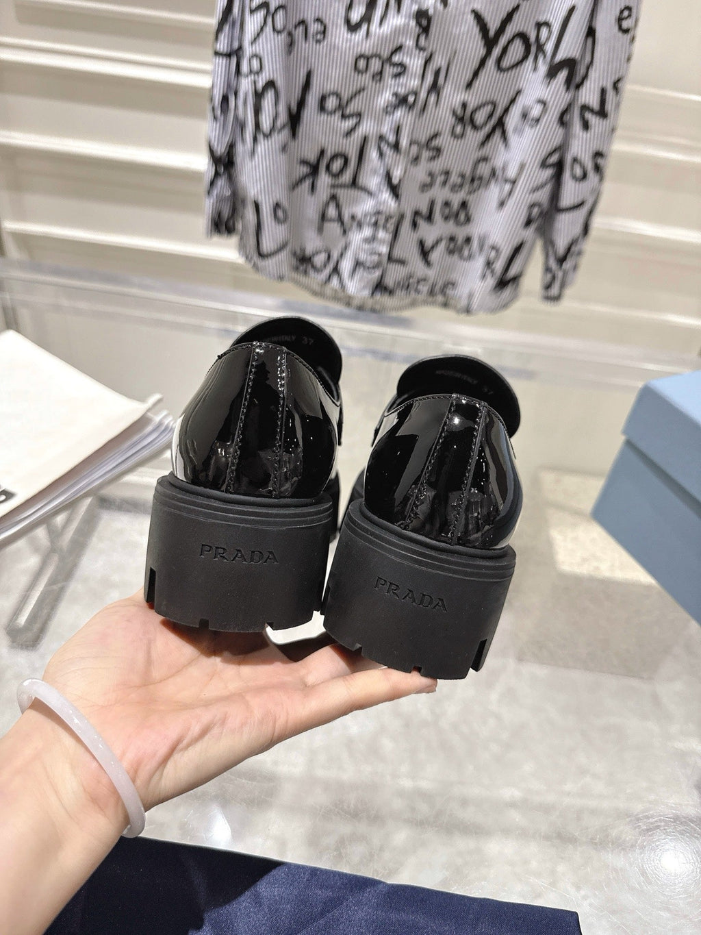 PRADA 26S PLATFORM LOAFERS 45MM IN BLACK PATENT CALFSKIN