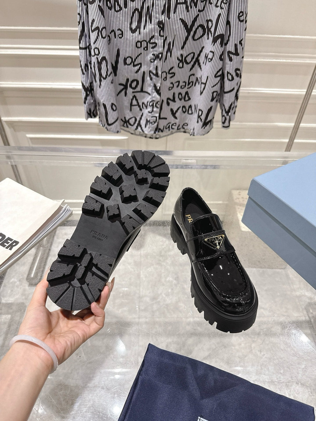 PRADA 26S PLATFORM LOAFERS 45MM IN BLACK PATENT CALFSKIN