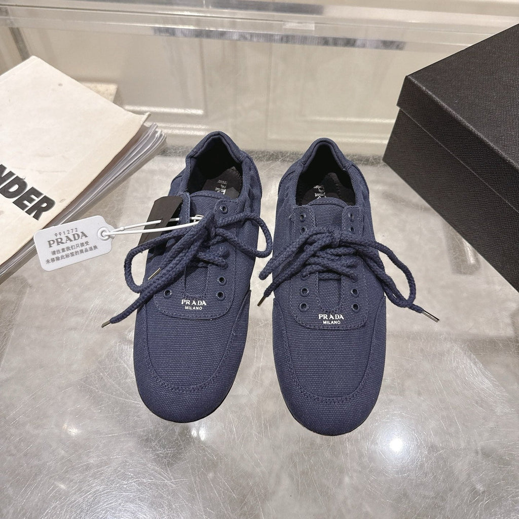 PRADA 26S COLLAPSE SNEAKERS IN BLUE CANVAS