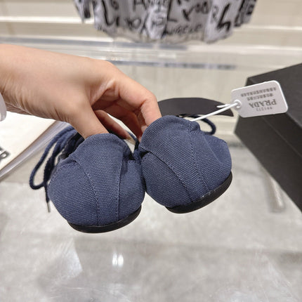 PRADA 26S COLLAPSE SNEAKERS IN BLUE CANVAS