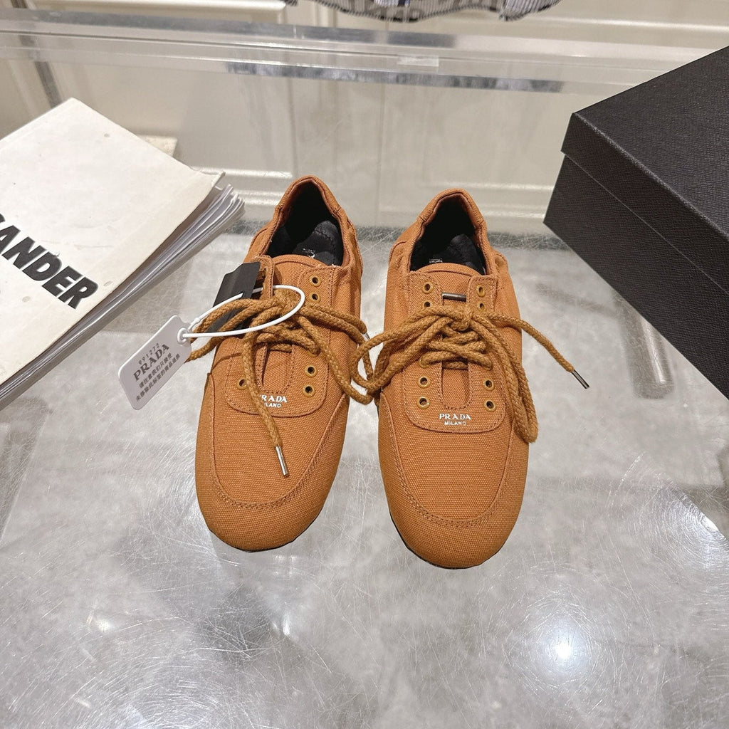 PRADA 26S COLLAPSE SNEAKERS IN CARAMEL BROWN CANVAS
