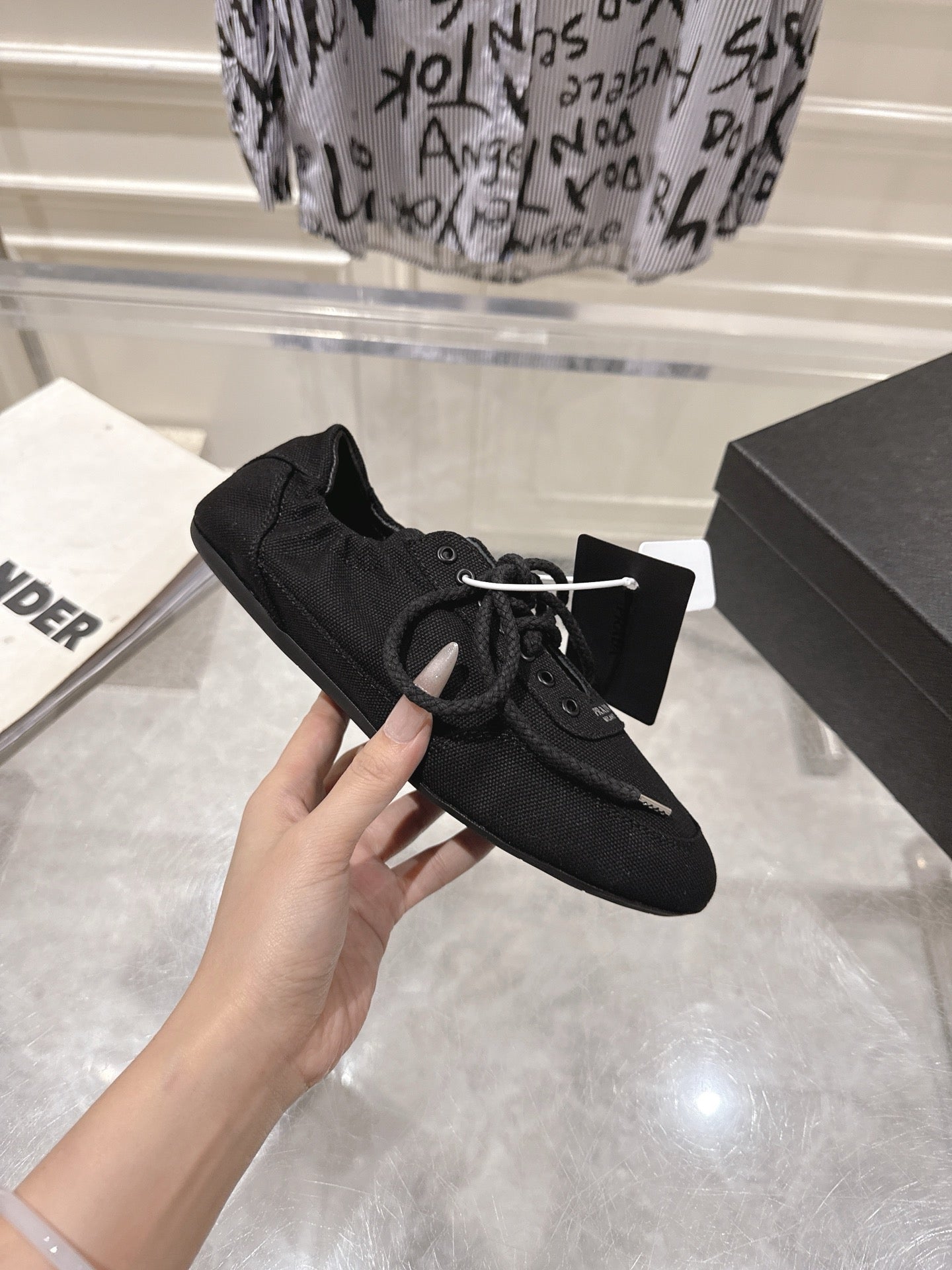 PRADA 26S COLLAPSE SNEAKERS IN BLACK CANVAS