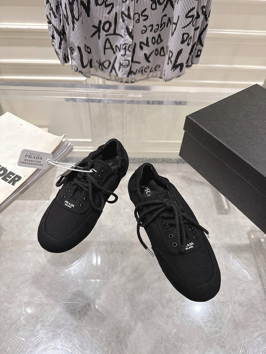 PRADA 26S COLLAPSE SNEAKERS IN BLACK CANVAS
