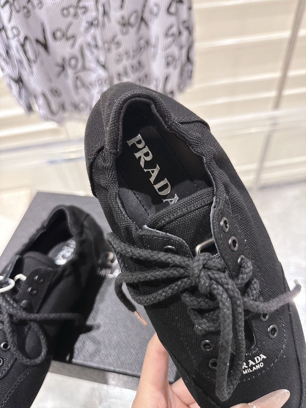 PRADA 26S COLLAPSE SNEAKERS IN BLACK CANVAS