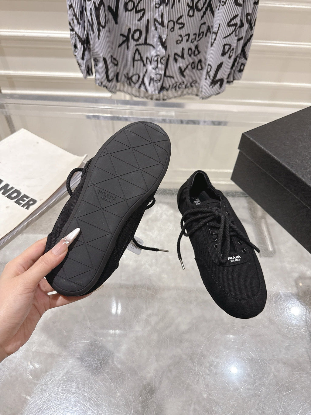 PRADA 26S COLLAPSE SNEAKERS IN BLACK CANVAS