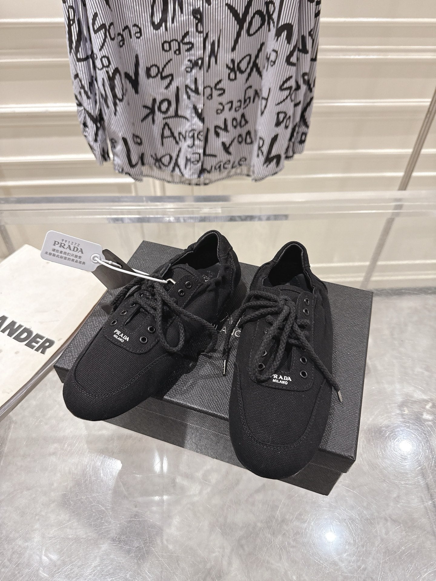 PRADA 26S COLLAPSE SNEAKERS IN BLACK CANVAS