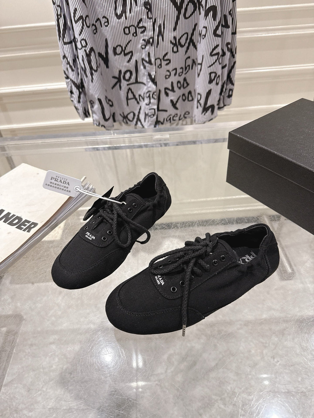 PRADA 26S COLLAPSE SNEAKERS IN BLACK CANVAS