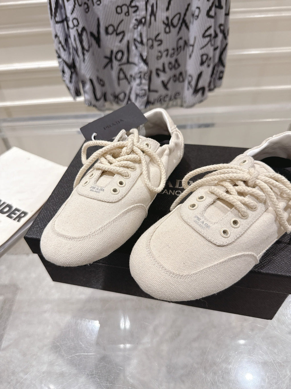 PRADA 26S COLLAPSE SNEAKERS IN WHITE CANVAS