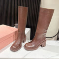 MIUMIU 26S HIGH-ANKLE BOOTS 50MM IN BROWN GLOSSY CALFSKIN