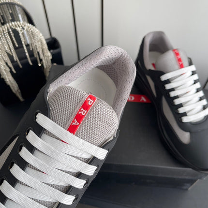 PRADA 26S AMERICA CUP SNEAKERS IN BLACK SOFT RUBBER AND BIKE FABRIC
