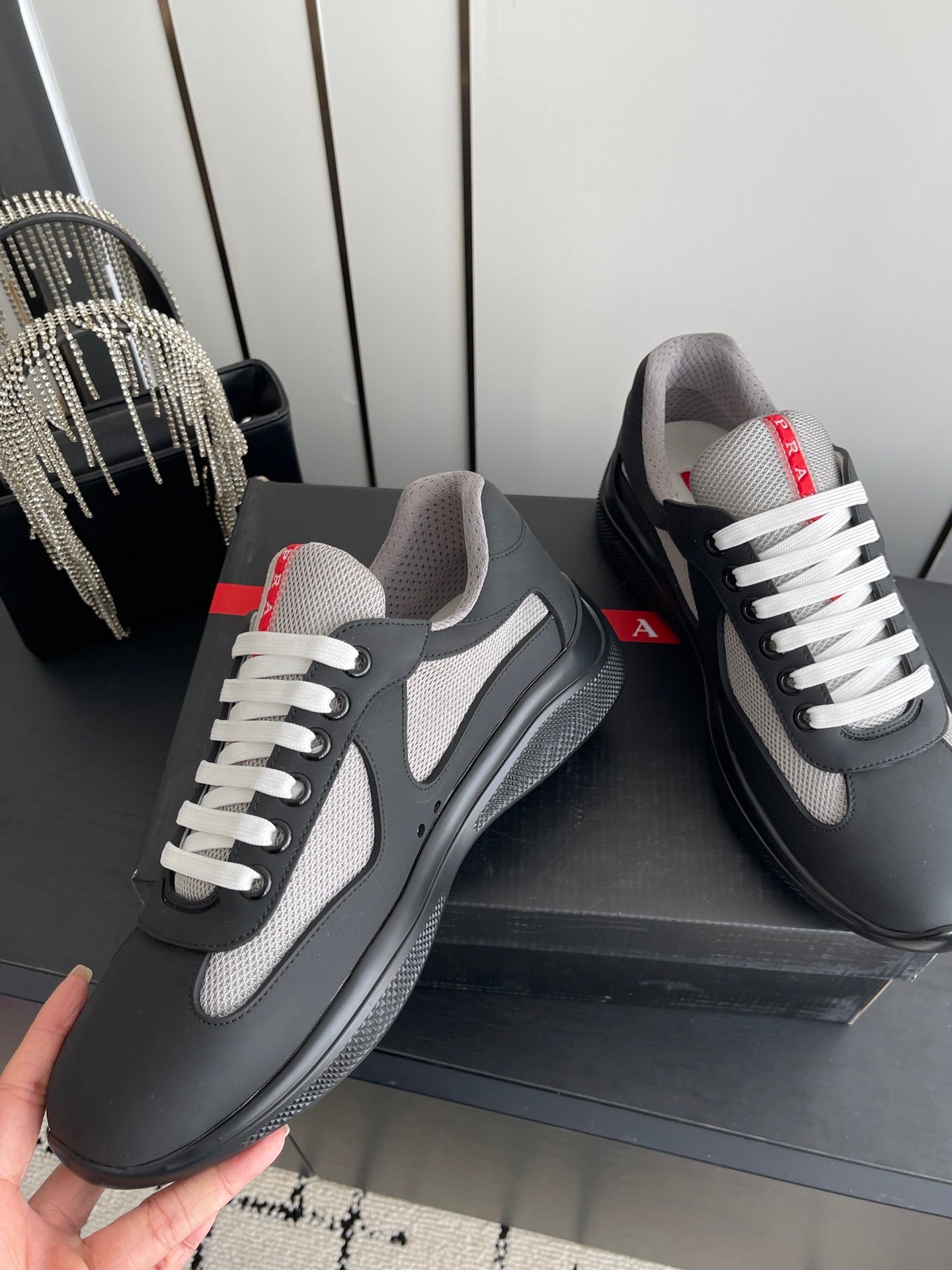 PRADA 26S AMERICA CUP SNEAKERS IN BLACK SOFT RUBBER AND BIKE FABRIC