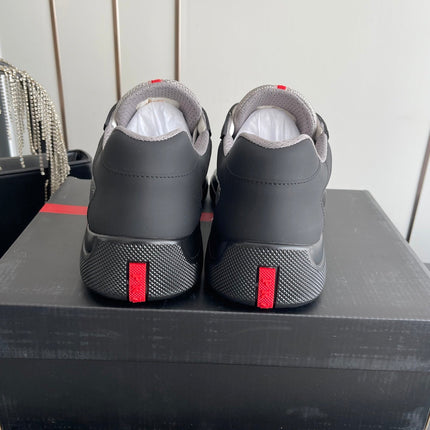 PRADA 26S AMERICA CUP SNEAKERS IN BLACK SOFT RUBBER AND BIKE FABRIC