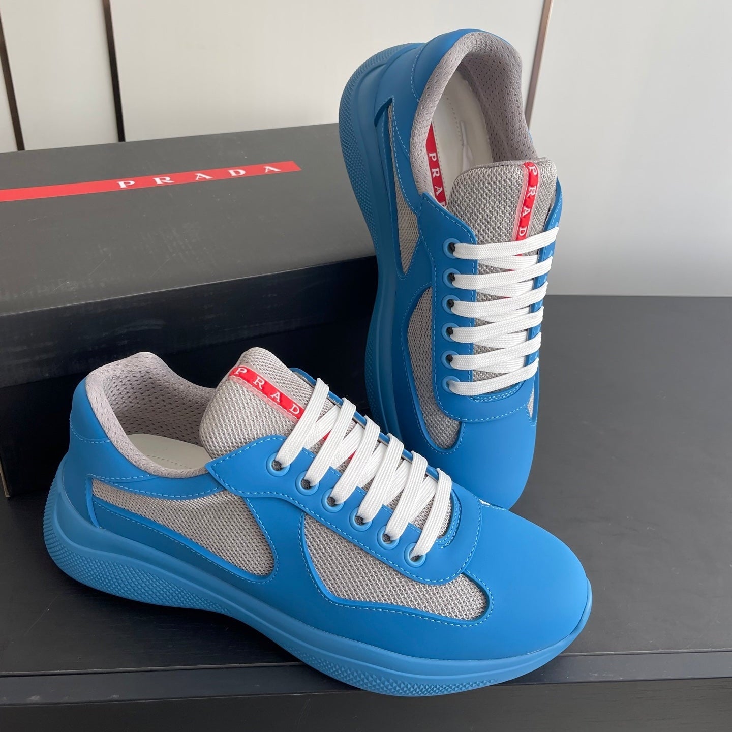PRADA 26S AMERICA CUP SNEAKERS IN AZURE BLUE SOFT RUBBER AND BIKE FABRIC