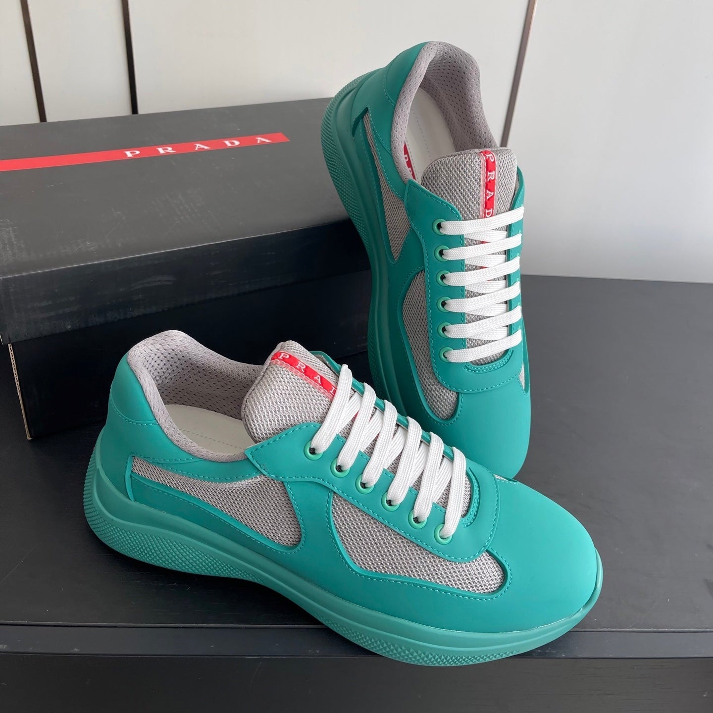 PRADA 26S AMERICA CUP SNEAKERS IN TEAL BLUE SOFT RUBBER AND BIKE FABRIC
