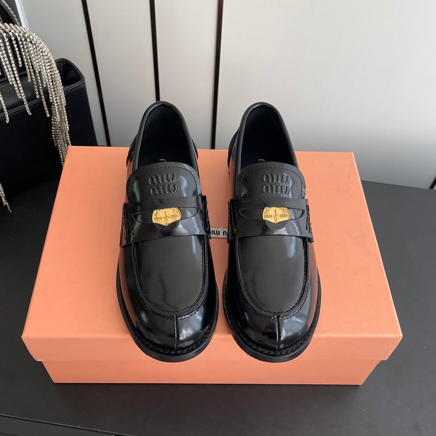 MIUMIU 26S PENNY LOAFERS IN BLACK GLOSSY CALFSKIN GOLD HARDWARE