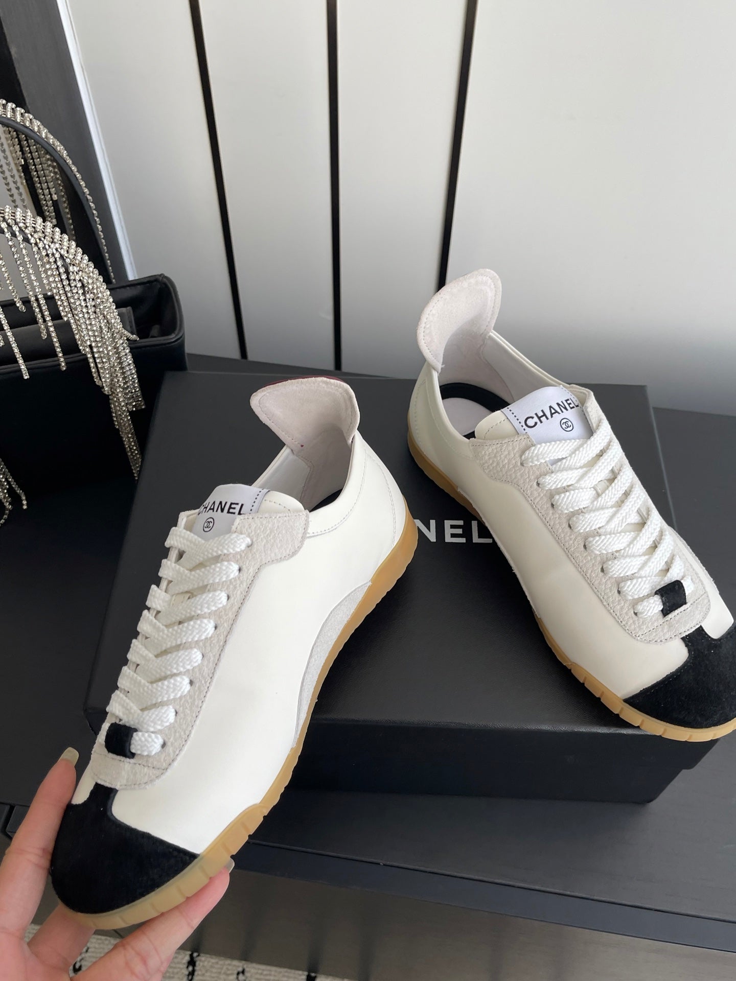 CHANEL LOW-TOP SNEAKERS IN BLACK AND WHITE CALFSKIN MIX SUEDE
