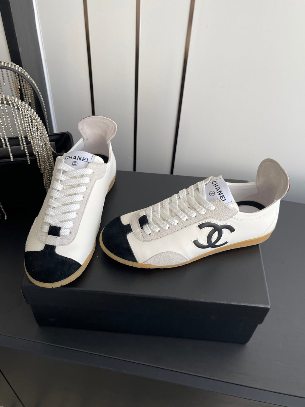 CHANEL LOW-TOP SNEAKERS IN BLACK AND WHITE CALFSKIN MIX SUEDE