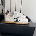 CHANEL LOW-TOP SNEAKERS IN BLACK AND WHITE CALFSKIN MIX SUEDE