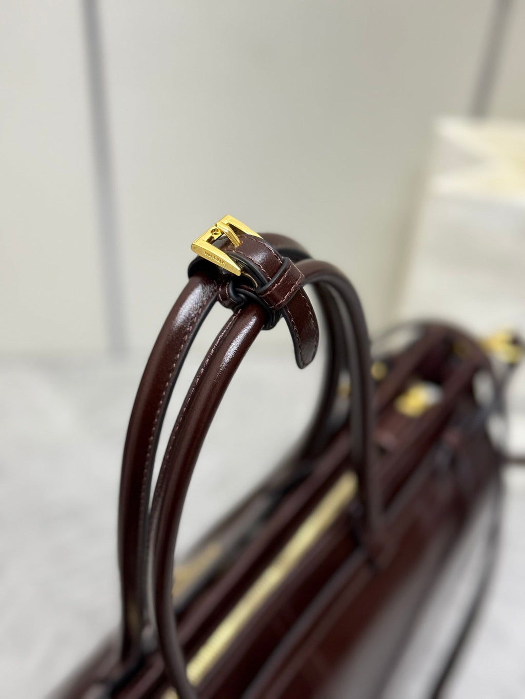 PRADA 25S BONNIE EXTRA-LARGE 42 IN DARK BROWN GLOSSY CALFSKIN GOLD HARDWARE