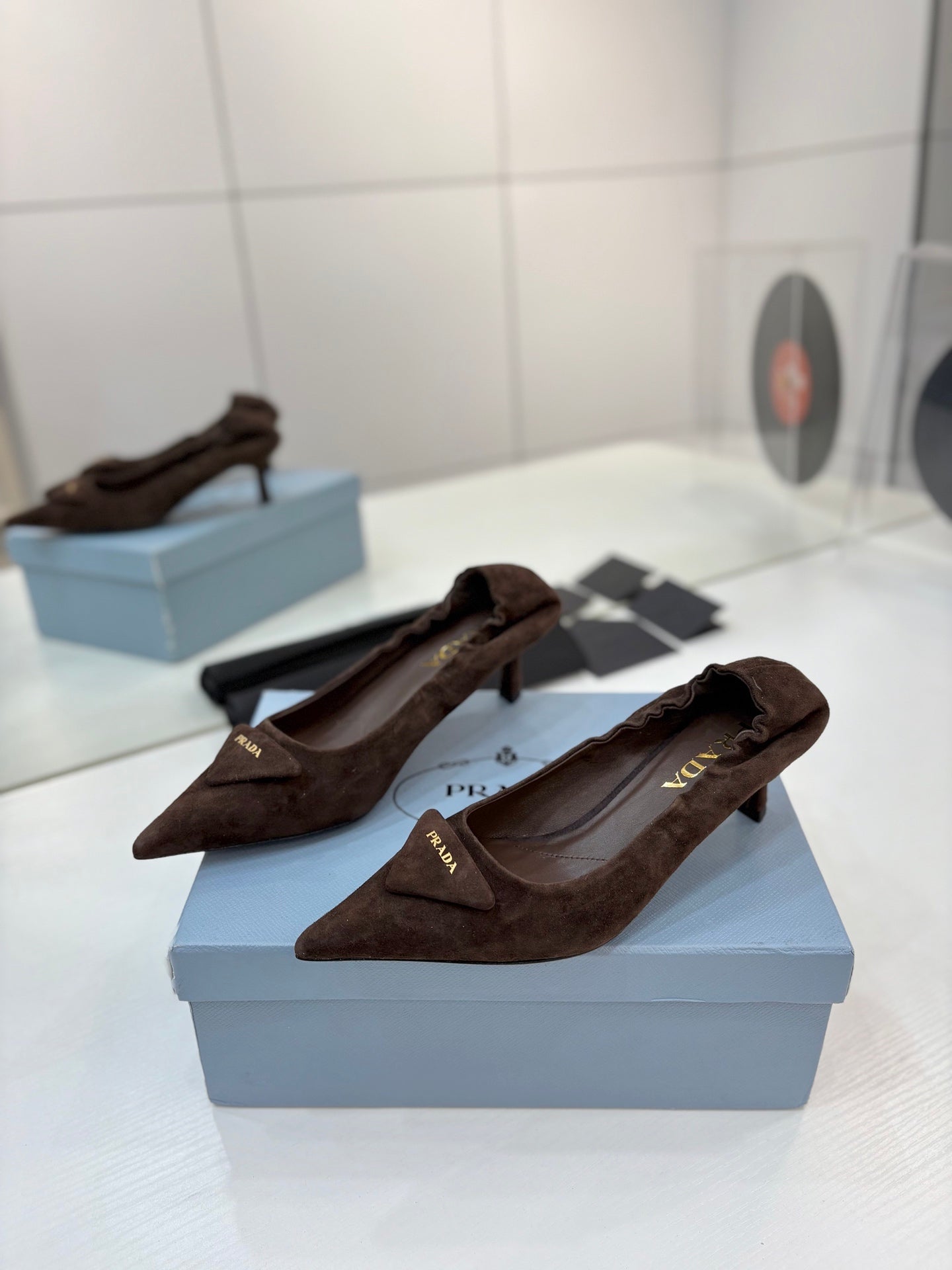PRADA 26S PUMPS 55MM IN DARK BROWN SUEDE WITH LOGO