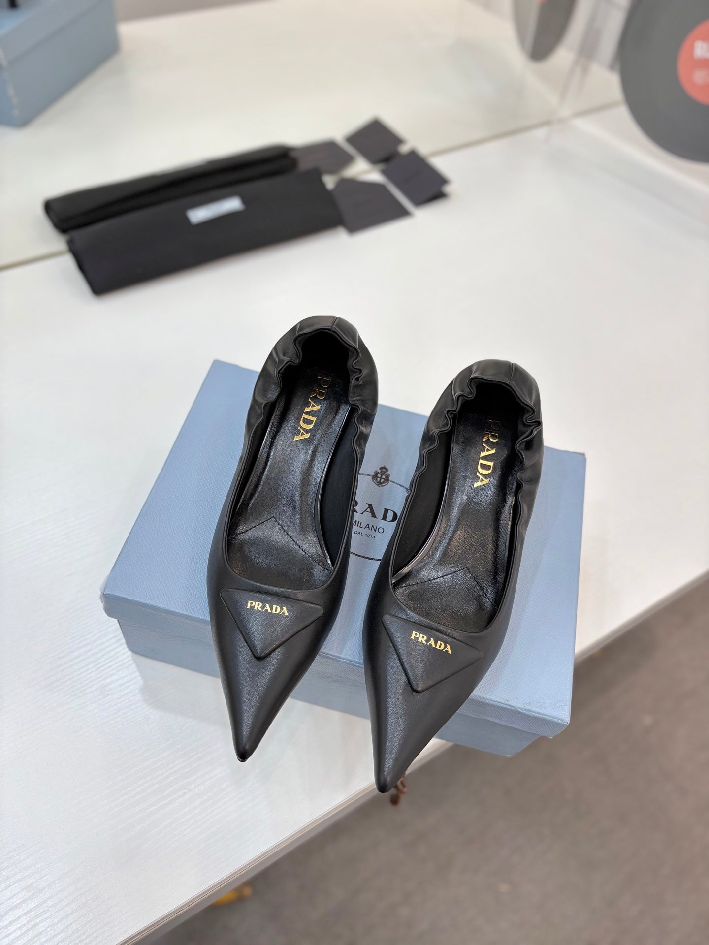PRADA 26S PUMPS 55MM IN BLACK CALFSKIN WITH LOGO