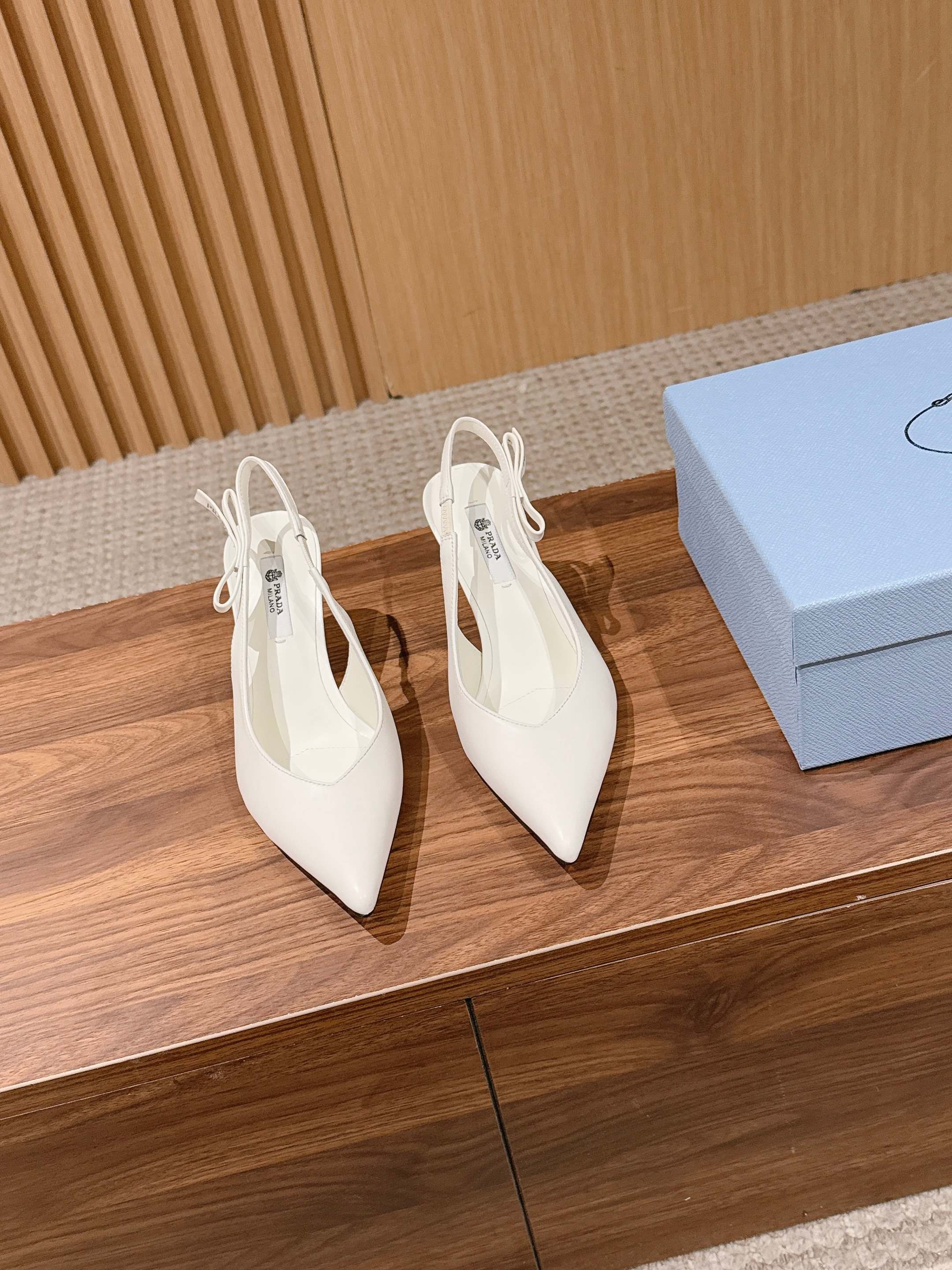 PRADA 26S SLINGBACK PUMPS IN WHITE CALFSKIN