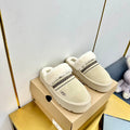 THICK-SOLED EMBROIDERED WARM FURRY CLOGS IN IVORY TAN SUEDE AND SHEARLING