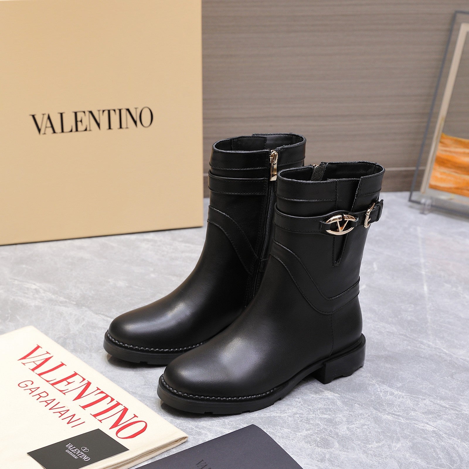 VALENTINO 25S FLAT ANKLE BOOTS IN BLACK CALFSKIN