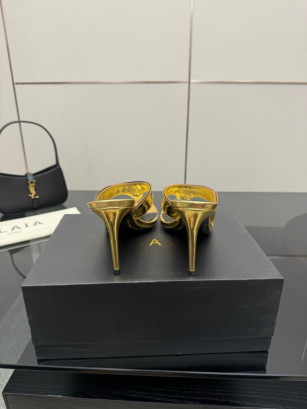 ALAIA HEELED THONG 25S IN GOLD PATENT LEATHER