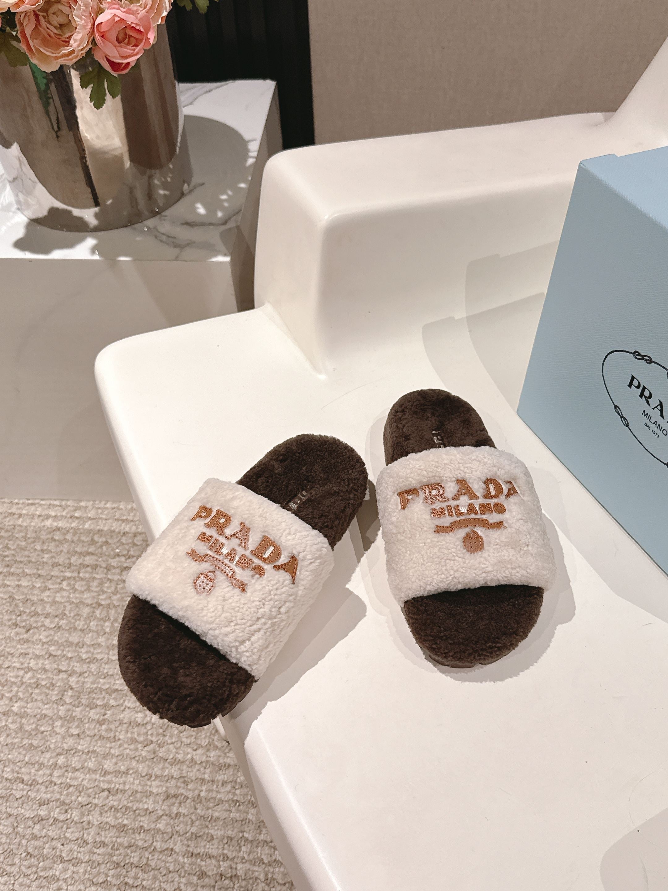 PRADA 25S FLAT MULES IN WHITE AND DARK BROWN RABBIT FUR