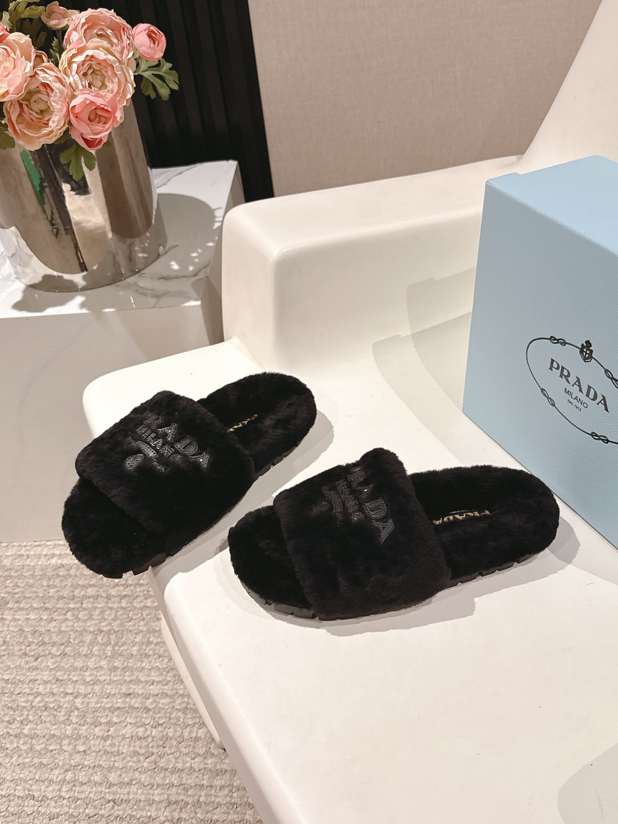 PRADA 25S FLAT MULES IN BLACK RABBIT FUR