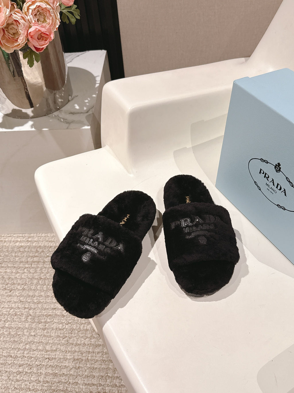 PRADA 25S FLAT MULES IN BLACK RABBIT FUR