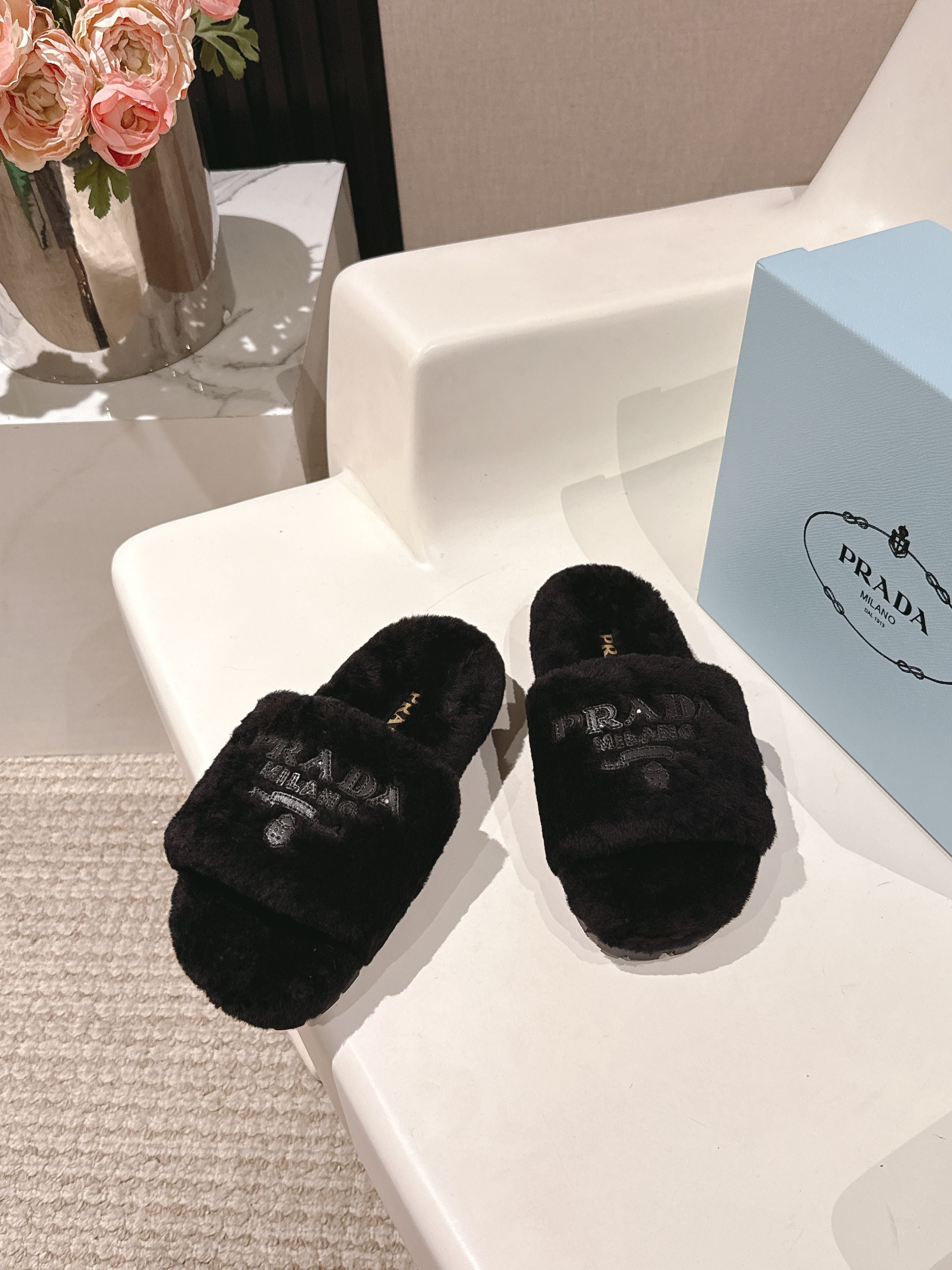 PRADA 25S FLAT MULES IN BLACK RABBIT FUR