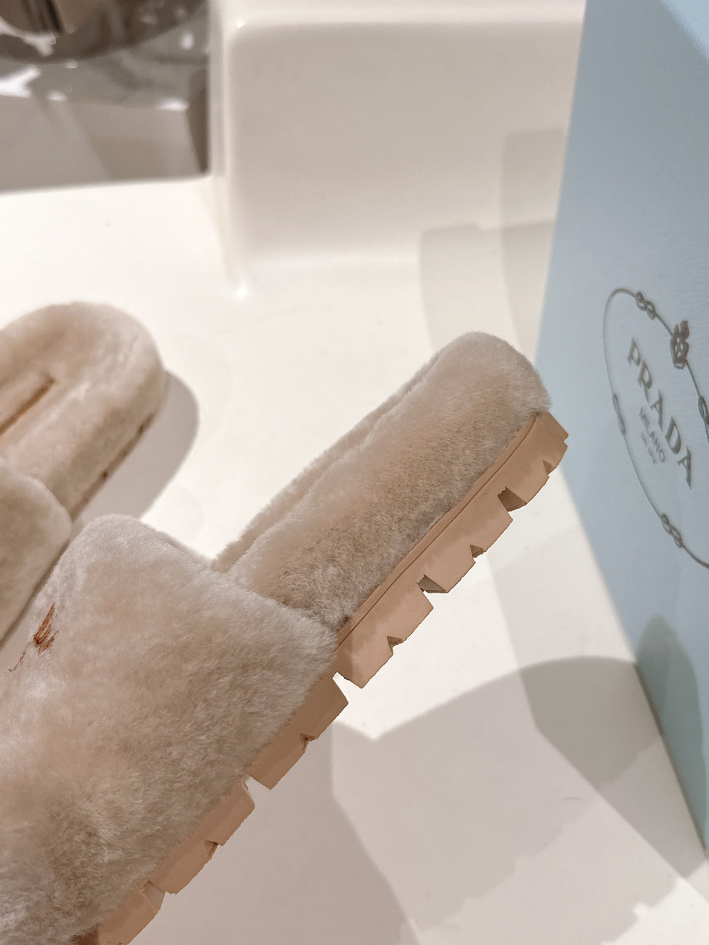 PRADA 25S FLAT MULES IN WARM TAUPE RABBIT FUR