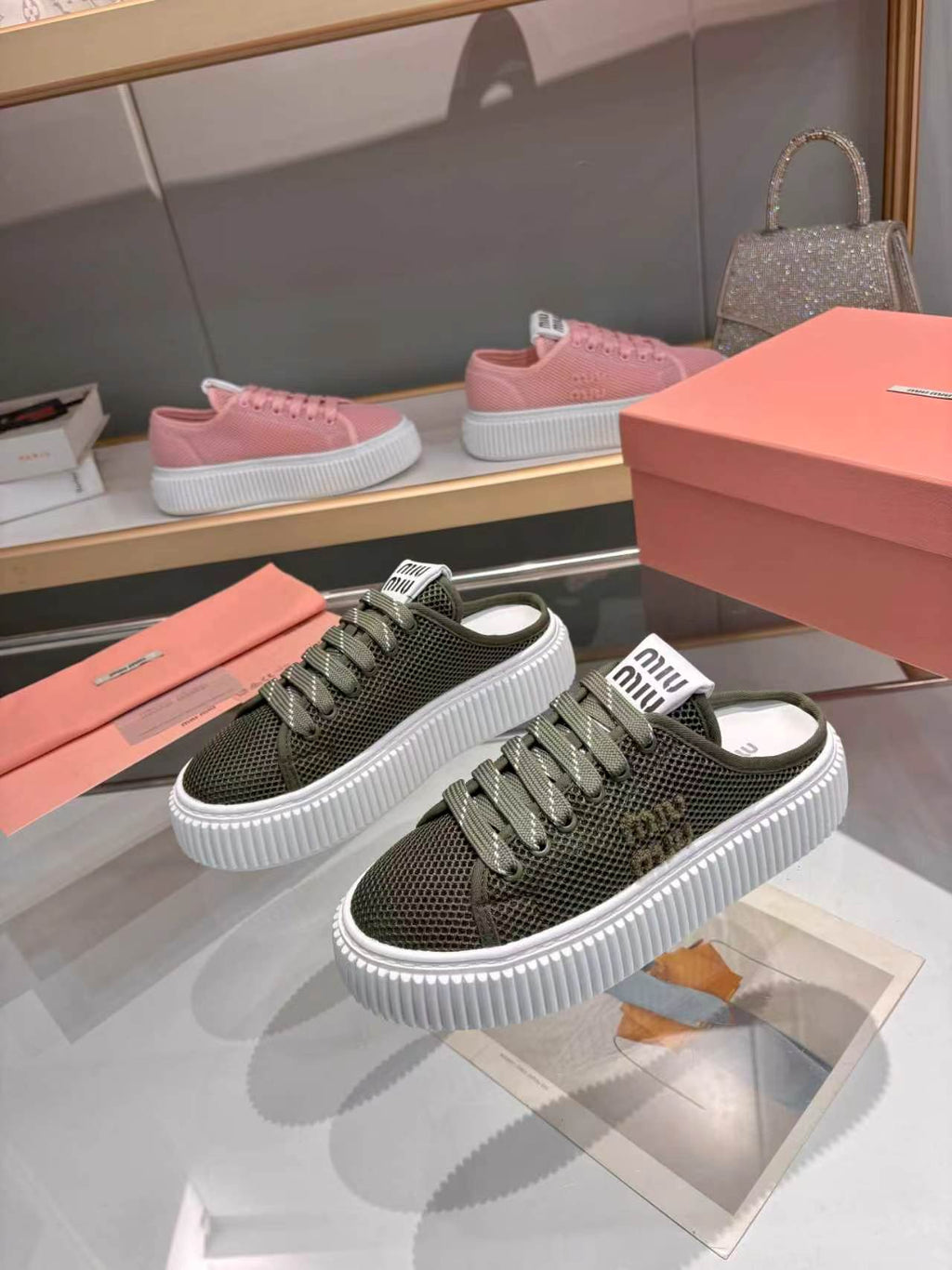 MIUMIU 26S SNEAKER MULES 45MM IN DARK OLIVE GREEN MESH