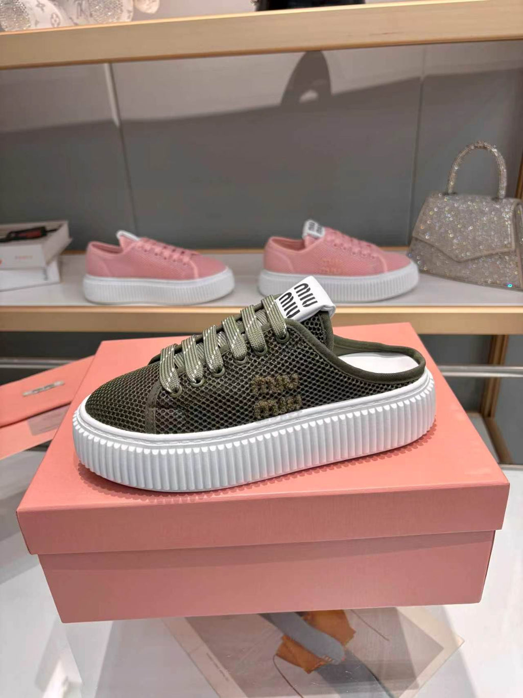 MIUMIU 26S SNEAKER MULES 45MM IN DARK OLIVE GREEN MESH