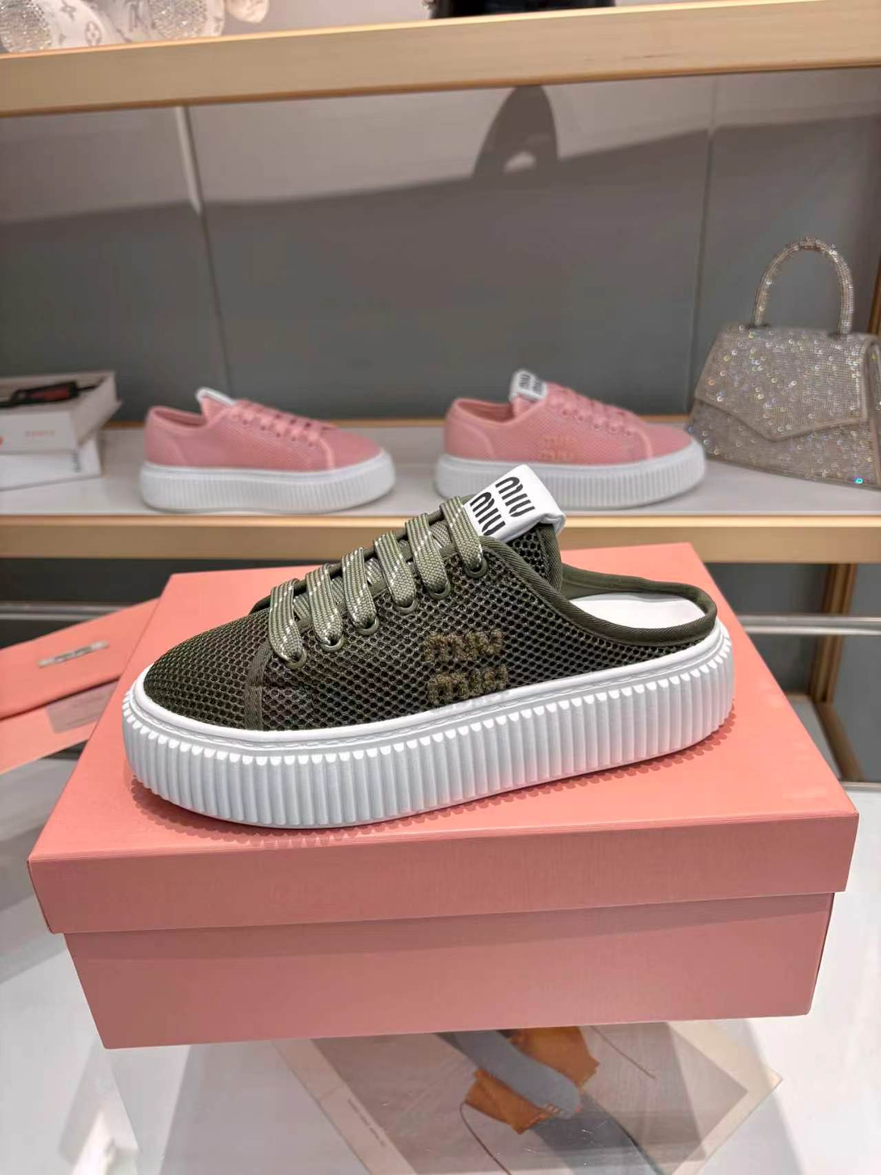 MIUMIU 26S SNEAKER MULES 45MM IN DARK OLIVE GREEN MESH