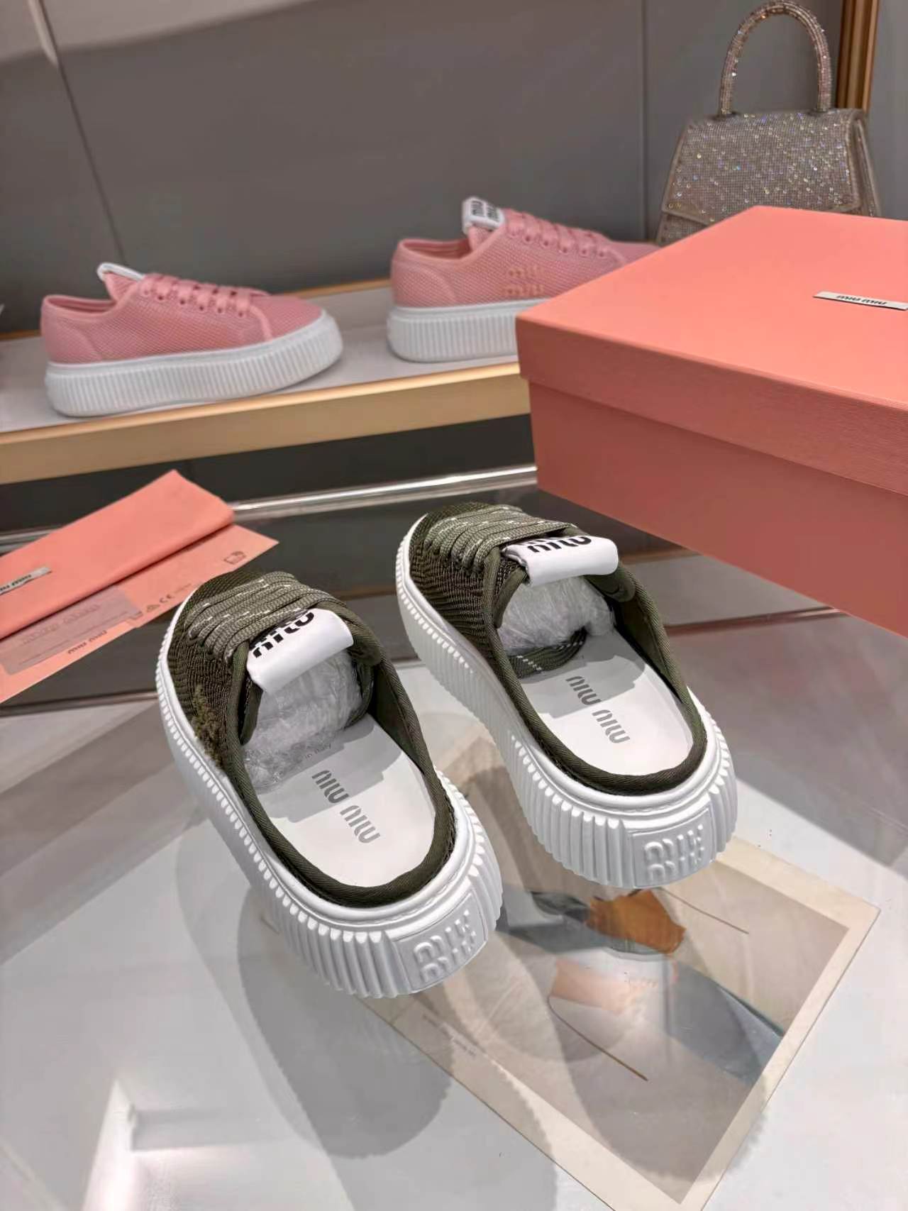 MIUMIU 26S SNEAKER MULES 45MM IN DARK OLIVE GREEN MESH