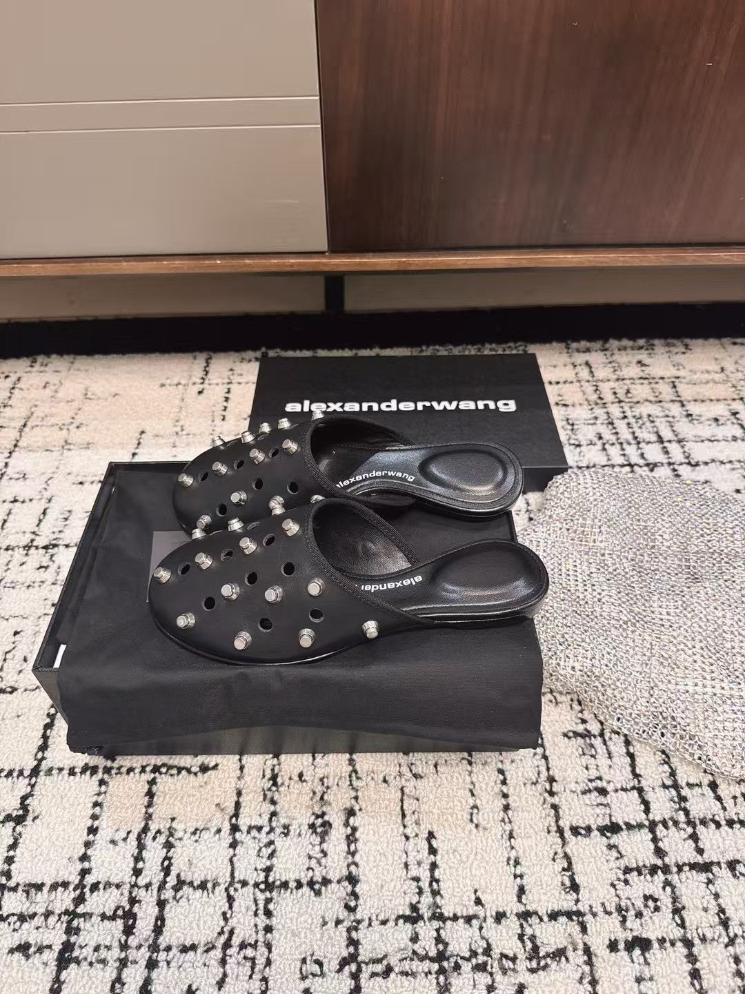 RHODES STUDDED FLAT MULE IN BLACK CALFSKIN