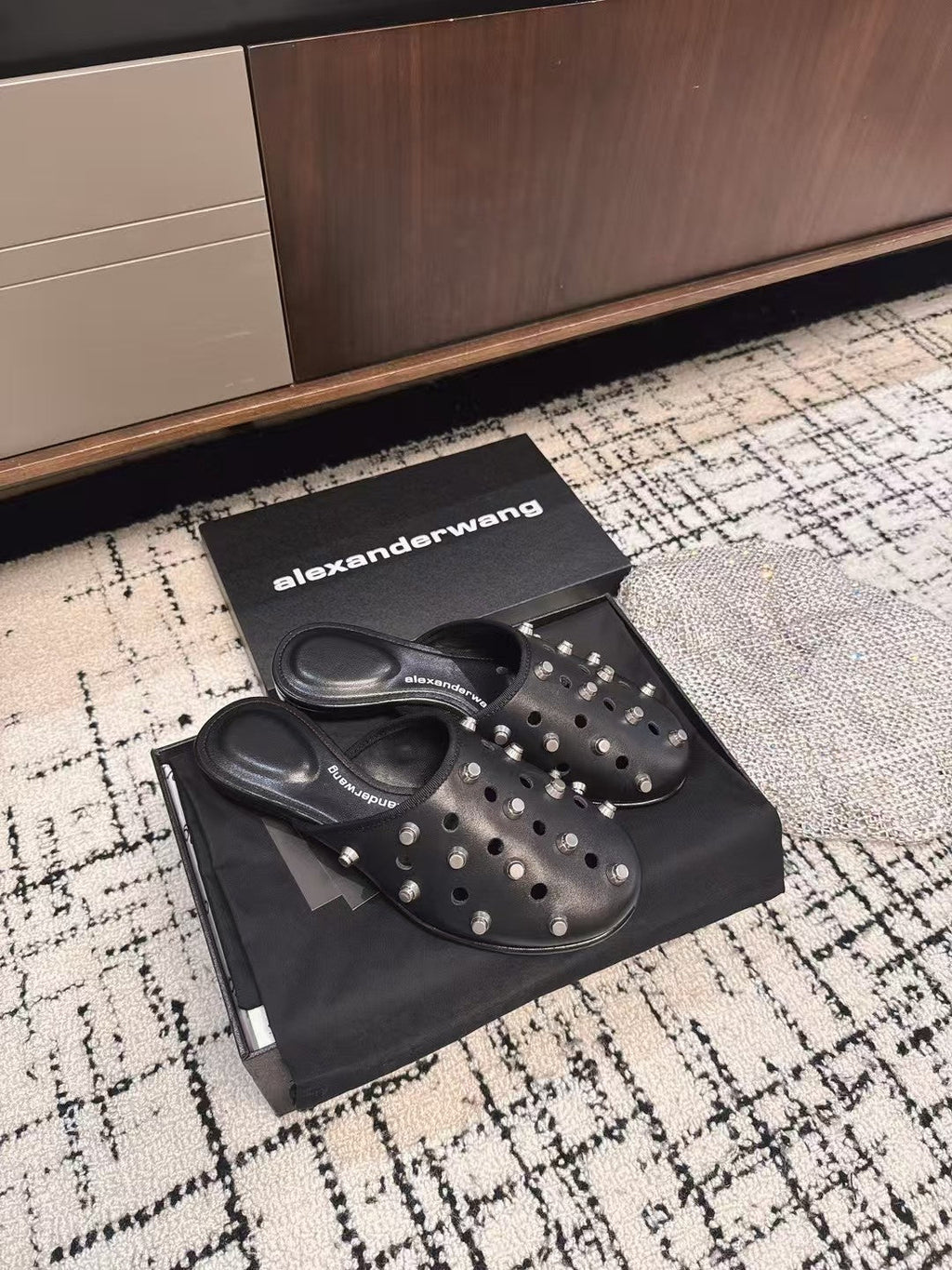 RHODES STUDDED FLAT MULE IN BLACK CALFSKIN