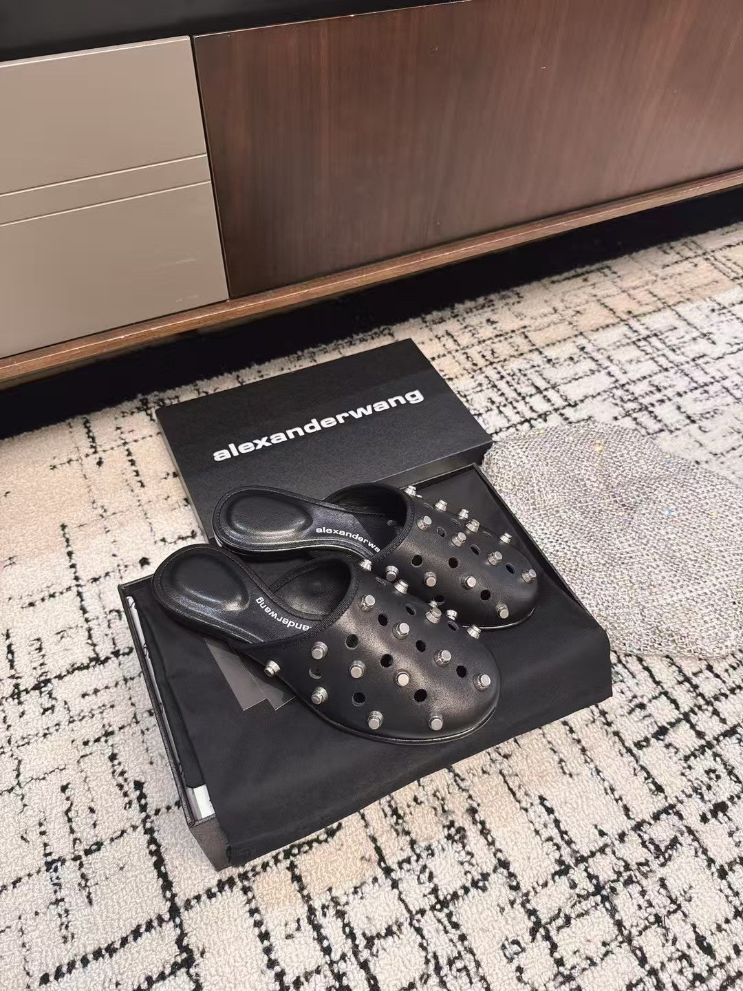 RHODES STUDDED FLAT MULE IN BLACK CALFSKIN