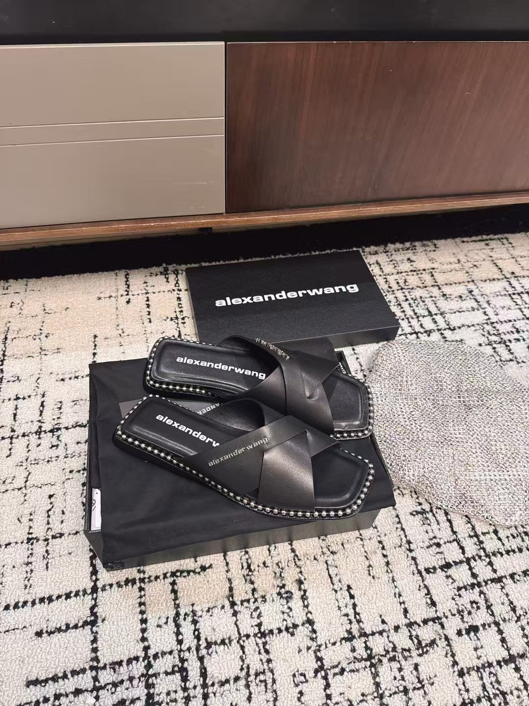 RHODES STUDDED SLIDE SANDAL IN BLACK CALFSKIN